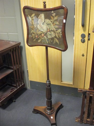 Lot 356 - A William IV carved rosewood fire-screen with...
