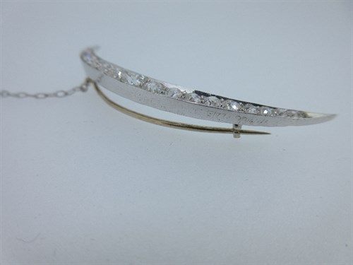 Lot 405 - A diamond open crescent brooch cased by Garrard