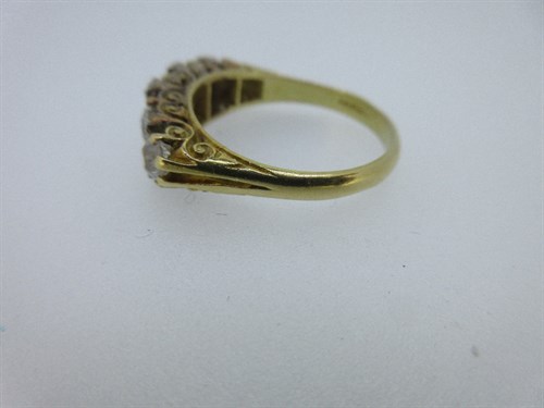 Lot 453 - An 18ct gold five stone diamond ring
