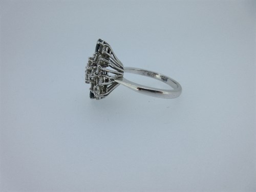 Lot 392 - An asymmetric diamond, sapphire and 18ct white gold cluster ring