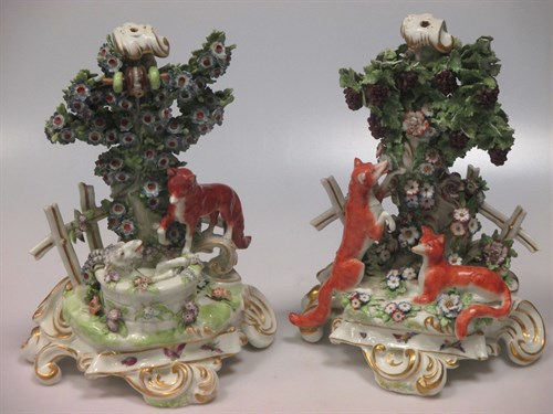 Lot 19 - A pair of Continental 19th century candlestick...