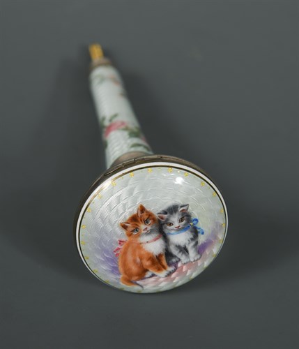 Lot 219 - An early 20th century white metal and enamel combination parasol handle