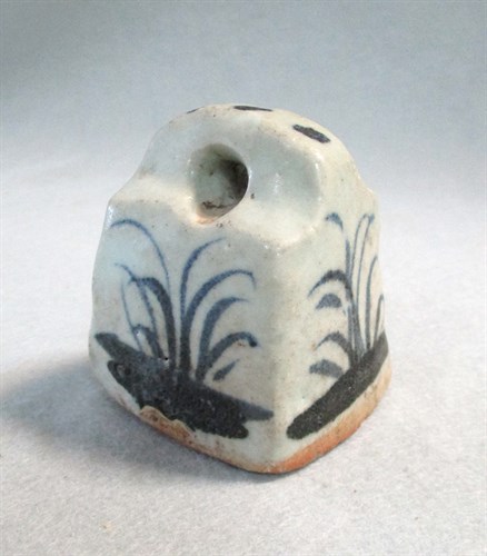 Lot 55 - A Ming blue and white weight