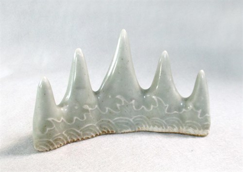 Lot 117 - A celadon-glazed brush rest, 19th century