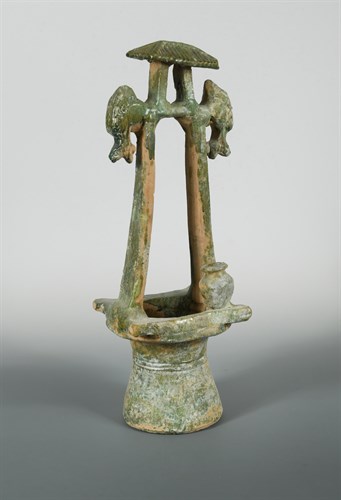 Lot 11 - A Han Dynasty green glazed model well