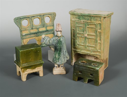 Lot 61 - A set of model furniture - a cupboard, stove, chest, and screen with one servant, Ming dynasty