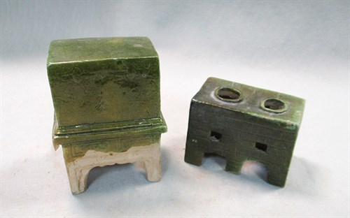 Lot 61 - A set of model furniture - a cupboard, stove, chest, and screen with one servant, Ming dynasty