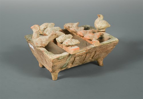 Lot 13 - A trough with ducks or poultry, Han dynasty