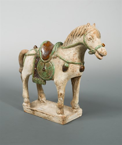 Lot 62 - A Ming Dynasty part-glazed horse