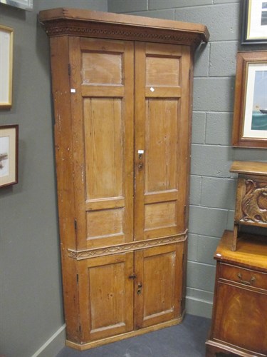 Lot 307 - A late Georgian pine freestanding corner...