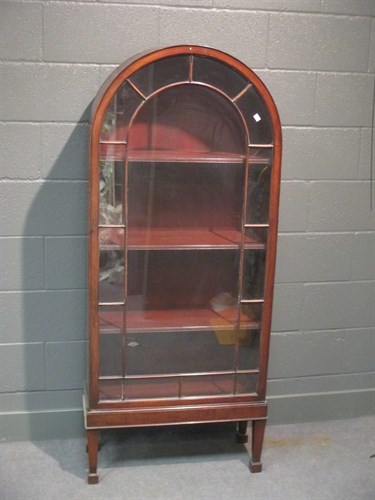 Lot 311 - A mahogany arched top glazed china cabinet on...