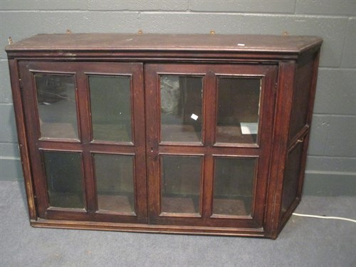 Lot 354 - An 18th century oak two door glazed hanging...
