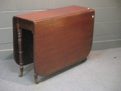 Lot 424 - A George IV mahogany drop flap table on turned...