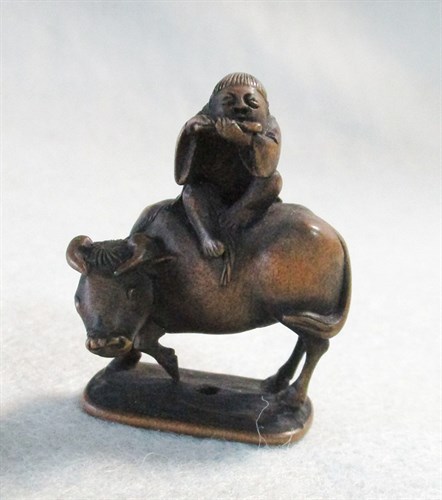 Lot 169 - A 19th century wooden netsuke signed Miwa