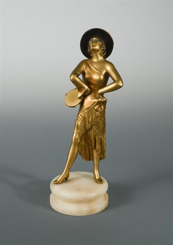Lot 49 - An Art Deco gilt and patinated spelter model of a female tambourine player