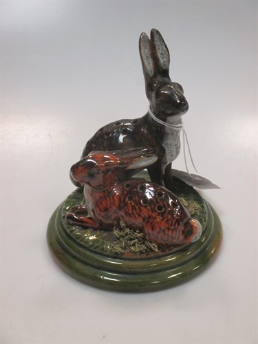 Lot 96 - A Pottery hares pin holder, maker's stamp...
