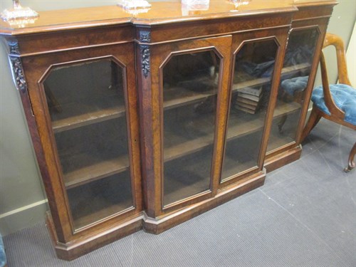 Lot 301 - A Victorian figured walnut breakfront bookcase,...