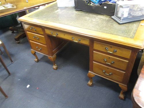 Lot 247 - A faded mahogany pedestal partners desk, on...