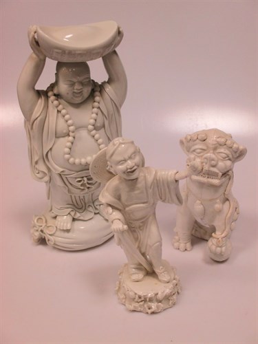 Lot 33 - A pair of Blanc de Chine, dog of fo and six...