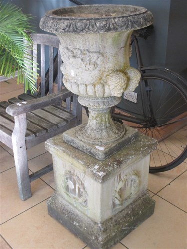 Lot 379 - A pair of composition garden urns on square...