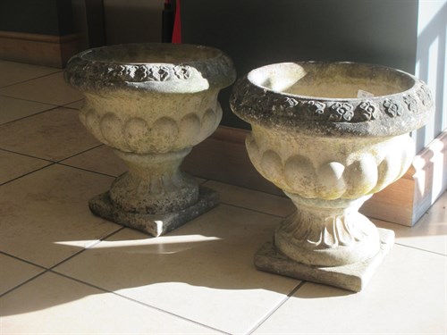 Lot 381 - Two pairs of composition garden urns on socle...
