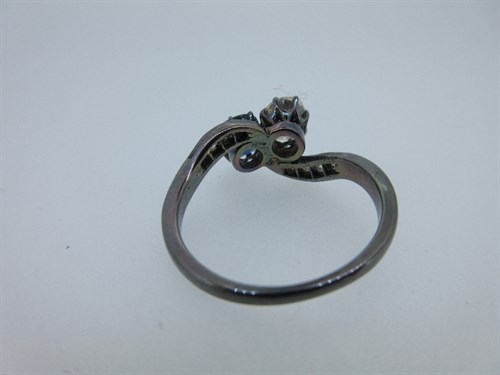 Lot 371 - A sapphire and diamond two stone crossover ring