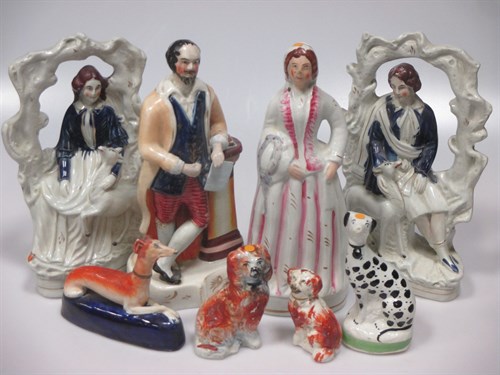 Lot 20 - A collection of Staffordshire figures to...