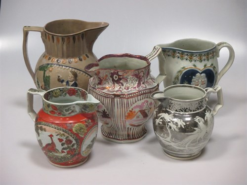 Lot 41 - A collection of English pottery jugs to...