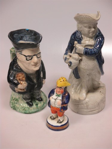 Lot 45 - A treacle glazed toby jug, character mug and a...