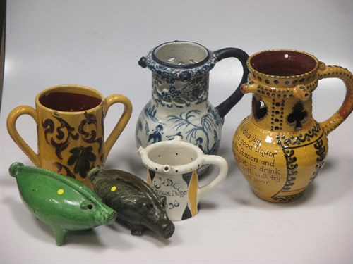 Lot 4 - A Bideford pottery puzzle jug and other items...