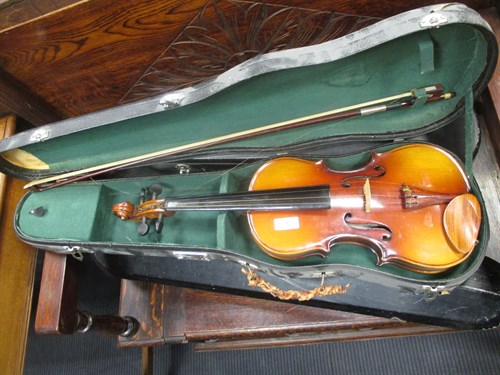 Lot 94 - A childs violin and bow made in Canton, a...