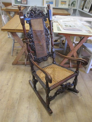 Lot 458 - A walnut high back armchair on later rockers