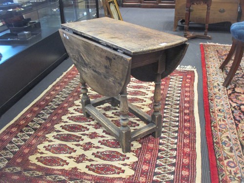 Lot 259 - A 17th century and later oak oval gateleg table