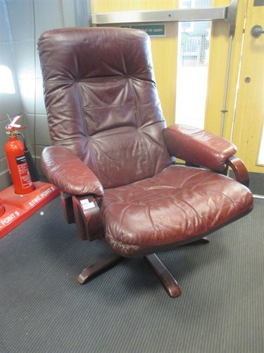 Lot 263 - A reclining leather armchair in the manner of...