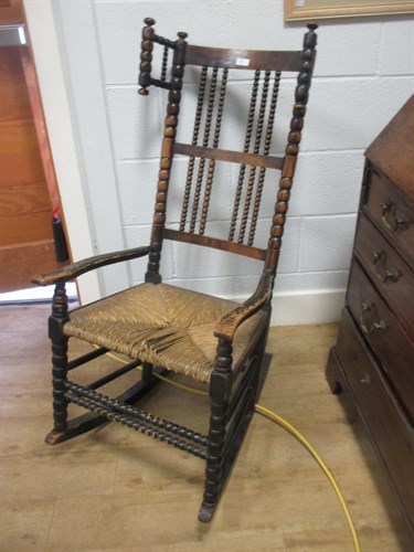 Lot 255 - A bobbin framed rocking armchair