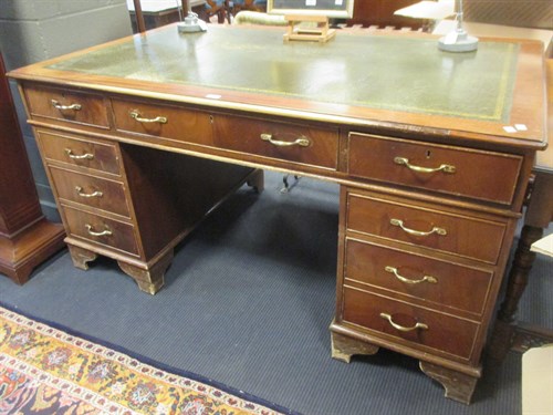 Lot 275 - A reproduction mahogany pedestal desk on...