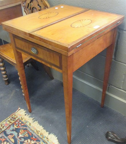 Lot 372 - An Edwardian satinwood card table with paterae...