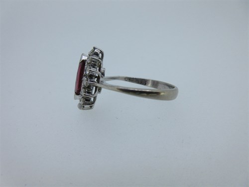 Lot 381 - A marquise ruby and diamond cluster ring