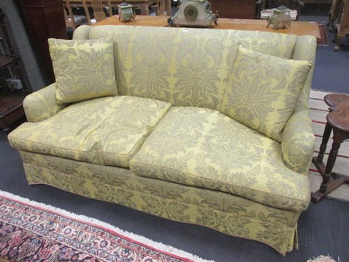 Lot 244 - A modern two-seater sofa in yellowed green...