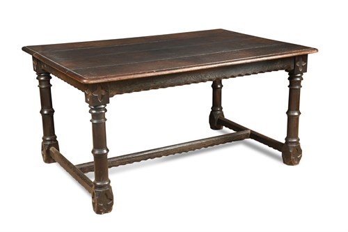 Lot 671 - An oak refectory table of traditional style,...