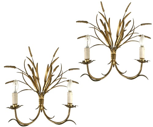 Lot 307 - A pair of gilt metal and gesso two branch wall lights