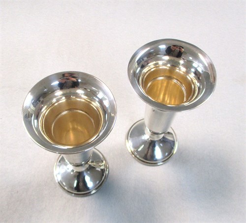 Lot 125 - A pair of George V silver trumpet vases