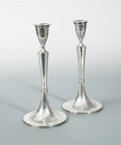 Lot 28 - A pair of Austrian metalwares table candlesticks