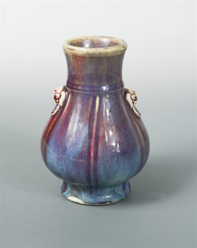 Lot 122 - A flambe glazed archaistic Hu shape vase, 19th century