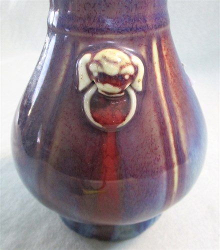 Lot 122 - A flambe glazed archaistic Hu shape vase, 19th century