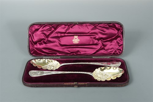 Lot 59 - A pair of George III silver table spoons with later decoration