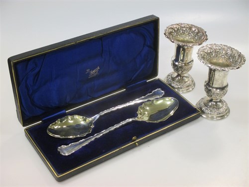 Lot 279 - A pair of sliver vases with loaded bases, and...