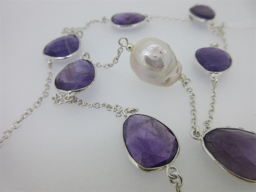 Lot 438 - An amethyst and cultured baroque pearl necklace together with a pair of amethyst earpendants