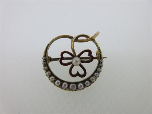 Lot 248 - A seed pearl and enamel crescent and shamrock brooch