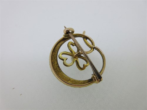 Lot 248 - A seed pearl and enamel crescent and shamrock brooch